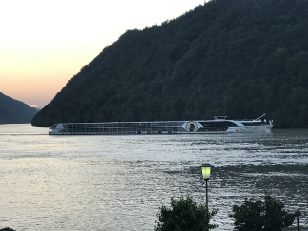 River cruise boat at dusk Schlogen Loop of Danube